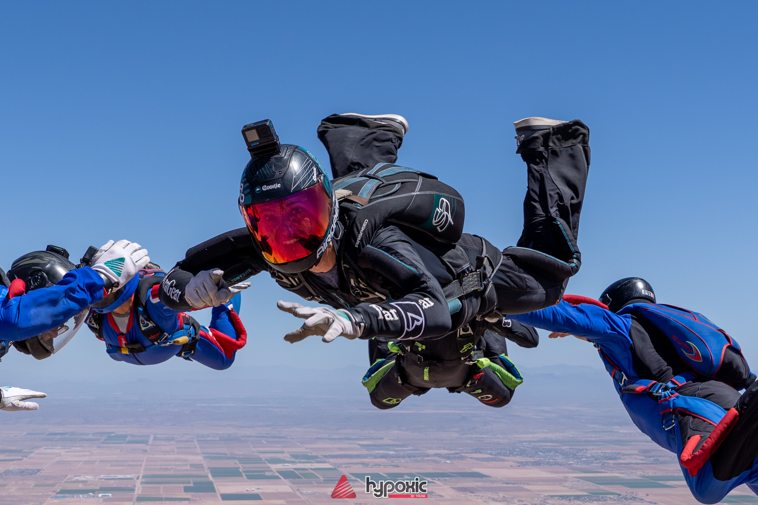 Doug Hendrix smiling in freefall during a formation skydive